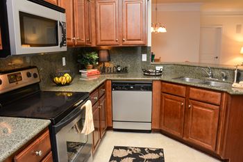 Gourmet kitchens with granite countertops and whirlpool stainless style appliances